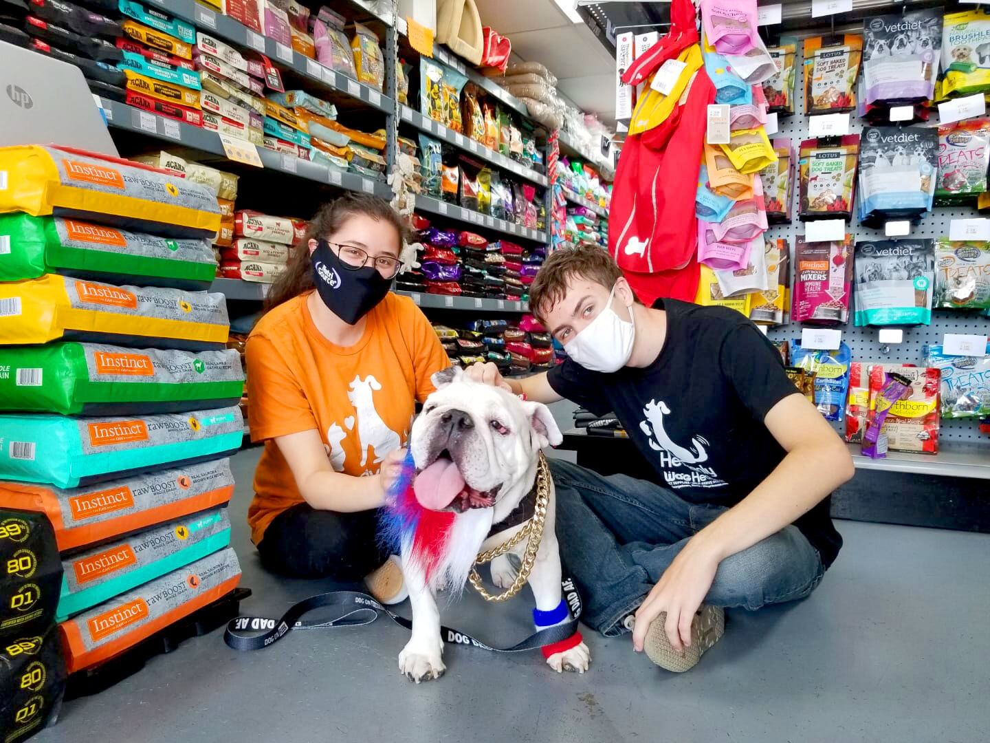 Staff Members Marissa Mendoza and William Wooten with regular customer Bronson.jpg